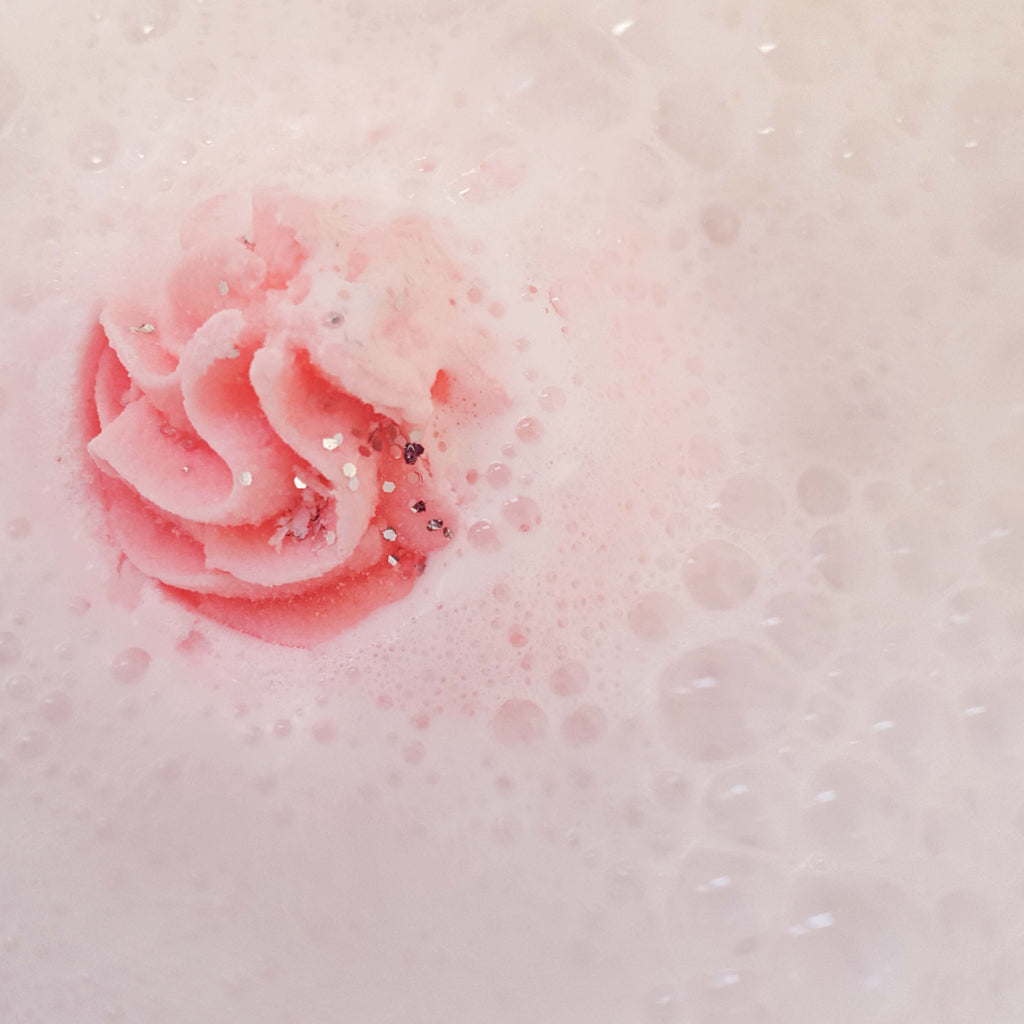 Cotton Candy Bath Blaster fizzing, releasing its pastel pink hue into the water