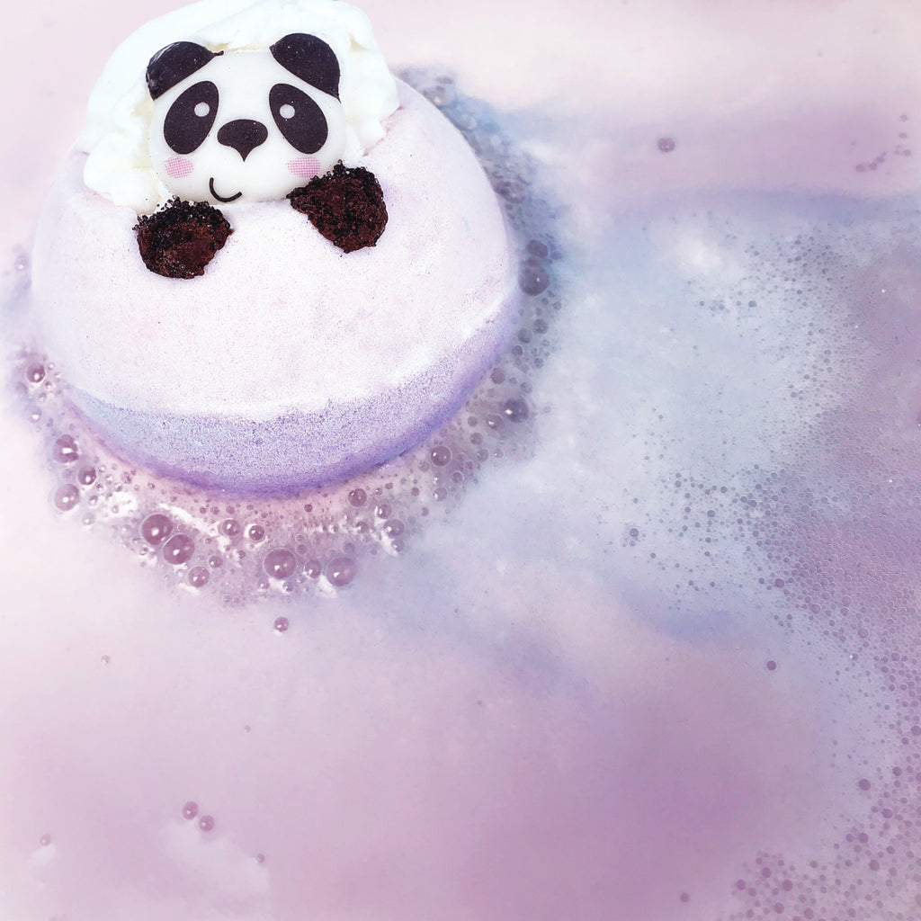 Bear With Me Bath Blaster fizzing, releasing it's purple hue into the water